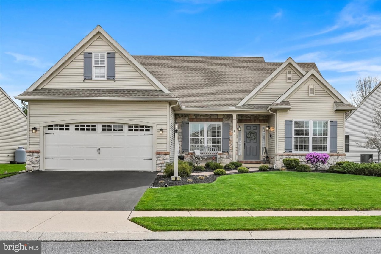 16 Bloomfield DrClay Twp to this charming 55+ community