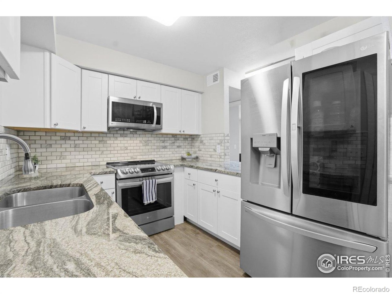 4450 S Pitkin St #126 Meadow Point Condos Ph 1-2 & 3 Welcome to this beautifully maintained two-story condo, offering modern updates and timeless... Aurora Arapahoe CO 80015 IR1047876 condo for sale $280,000 IR1047876 Photo 4