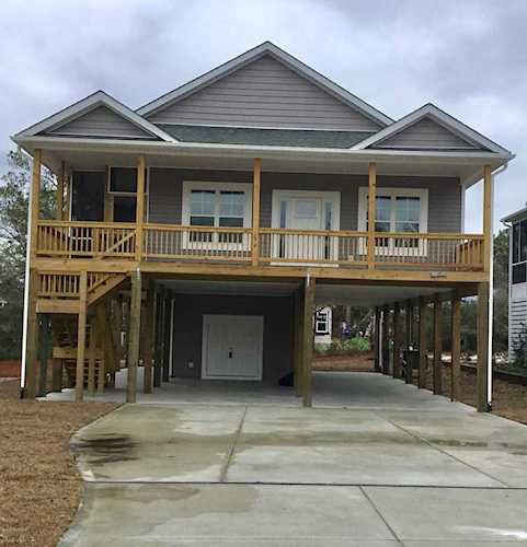 132 NE 22nd Street Oak Island Wooded, NC 28465 | MLS 100145602 Photo 1