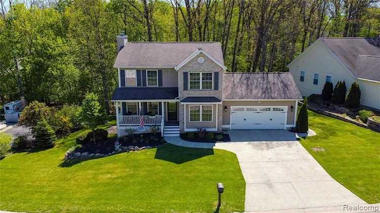 1888 Hickory Hills Blvd Oceola Twp, MI 48855 | MLS 2210039619 Photo 1