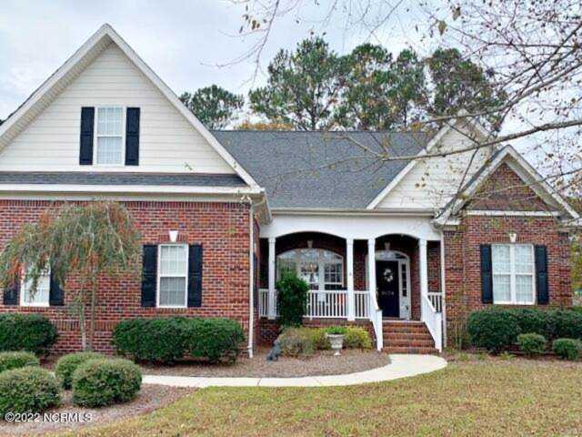 1034 Ridgemont Dr Leland, NC in Magnolia Greens. A beautiful brick home, the GILLIKEN PLAN, built by Fogleman Associates Builder, specializing in... Photo 1