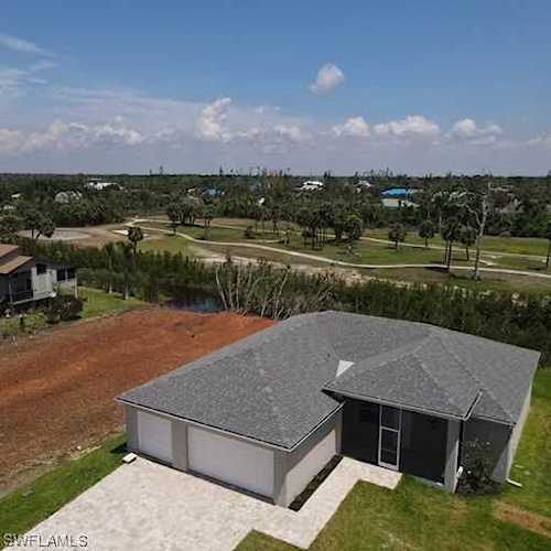 14372 Clubhouse Dr Bokeelia, FL 33922 | MLS 223006000 Photo 1