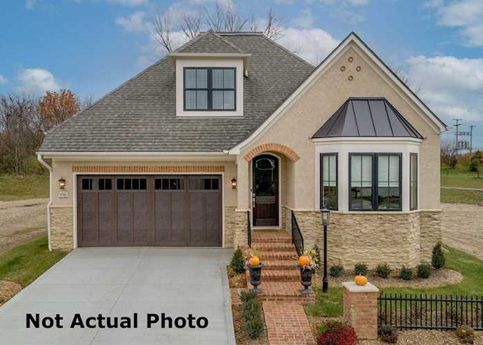 For Sale: $945,000 A home for sale for sale at 9367 Roma Drive Dublin, OH 43017 - Union. MLS 223003334 - Old European inspired exterior throughout the exclusive Hamlet on Jerome, Custom ranch features 1st... Photo 1