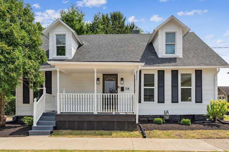For Sale: $219,000 A home for sale for sale at 114 N 7th Street Newark, OH 43055 - Licking. MLS 223026357 - This beautiful Cape Cod-style home offers a spacious 1750 square feet of living space, with three... Photo 1