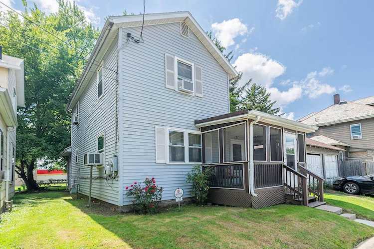 For Sale: $119,500 A home for sale for sale at 121 Wallace Street Marion, OH 43302 - Marion. MLS 223027931 - Enjoy sitting on the screened porch at this 3 bedroom, 2 bath home with newer windows, first floor... Photo 1