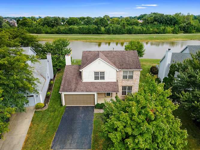 For Sale: $380,000 A home for sale for sale at 2758 Lake Hollow Road Hilliard, OH 43026 - Franklin. MLS 223030203 - This property is a stunner! With waterfront views from the entire backyard, welcome home to this... Photo 1
