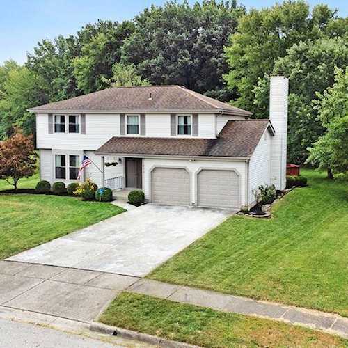 For Sale: $360,000 A home for sale for sale at 832 Quitman Drive Columbus, OH 43230 - Franklin. MLS 223030230 - Immaculate home located on a well maintained .41 acre lot!!! Large Owner's Suite with en-suite... Photo 1