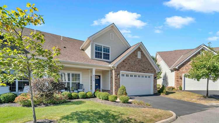 For Sale: $422,500 A home for sale for sale at 4606 Newport Loop Grove City, OH 43123 - Franklin. MLS 223030857 - Welcome Home! Step onto the full front porch & into the foyer, complete with arches, transom... Photo 1