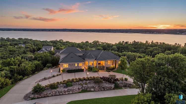 Stunning exterior view of luxury lake estate at 158 Signal Hill Rd, Yankton, SD