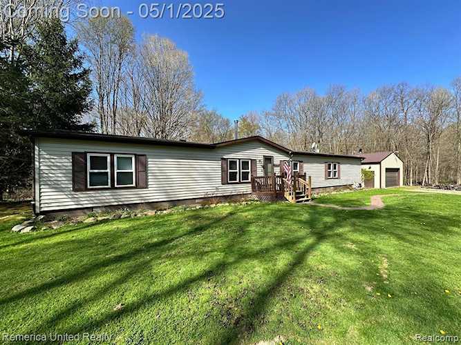 6565 W Coon Lake Rd in Iosco Twp, MI Photo 1